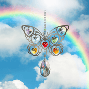 Butterfly Rainbow crystal suncatcher sparkling against a blue sky and rainbow backdrop

