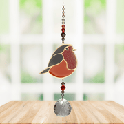 Wild Things Crystal Dreams Robin suncatcher hanging by a window with russet red bird and crystal drop