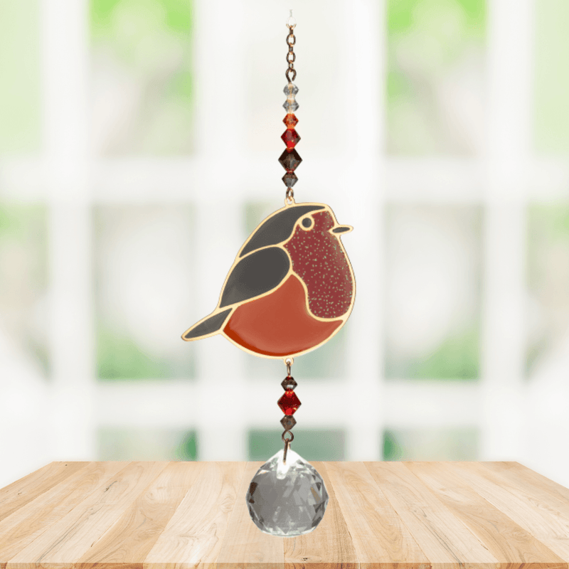 Wild Things Crystal Dreams Robin suncatcher hanging by a window with russet red bird and crystal drop