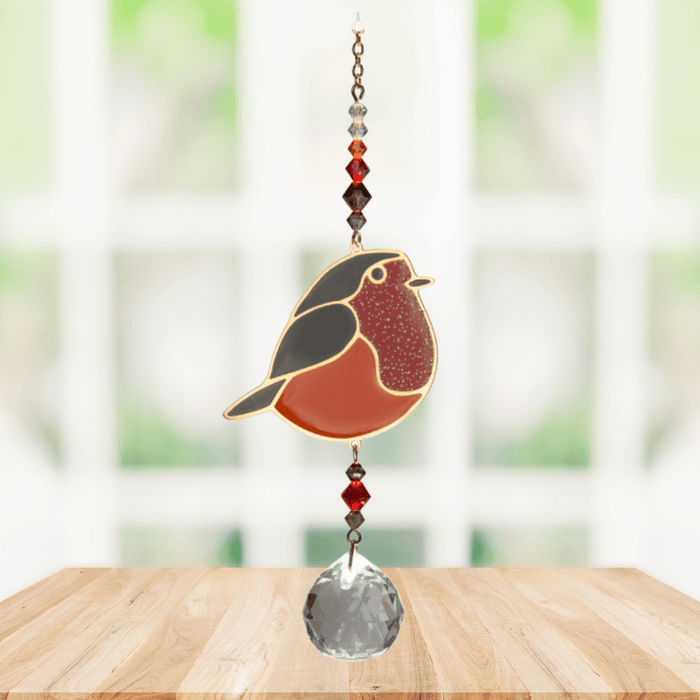 Wild Things Crystal Dreams Robin suncatcher hanging by a window with russet red bird and crystal drop