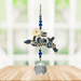 Wild Things Crystal Dreams Running Hare suncatcher hanging by a window with deep blue hare and crystal drop