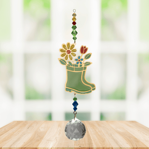 Wild Things Crystal Dreams Wellies suncatcher hanging by a window with colourful flower and crystal details