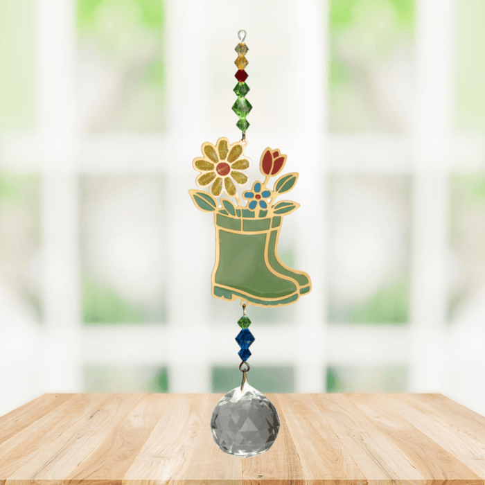 Wild Things Crystal Dreams Wellies suncatcher hanging by a window with colourful flower and crystal details