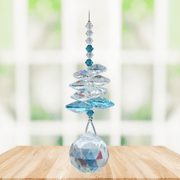 Wild Things Blue Zircon December birthstone crystal suncatcher hanging by window with 20mm faceted ball pendant