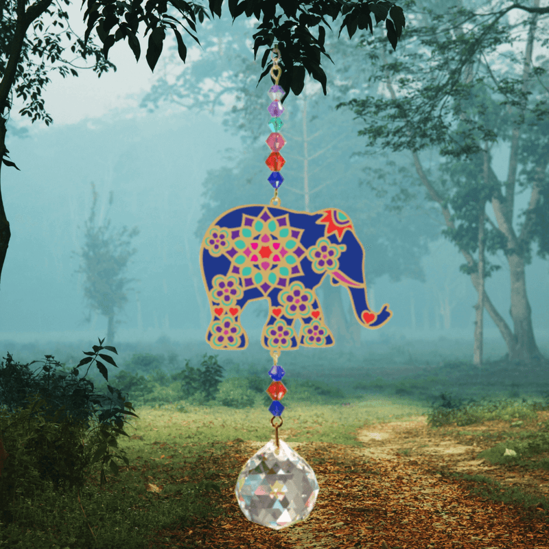 Elephant Indian Crystal Suncatcher above misty forest path – ornate navy elephant, colourful bead cascade and 20 mm prism scattering rainbow shards.

