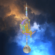 Fairy Aurora Crystal Suncatcher against dramatic twilight clouds – enchanted moon fairy, iridescent beads and 20 mm prism waiting to scatter colourful light.

