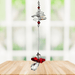 Garnet guardian angel crystal cascade suncatcher hanging in a bright window