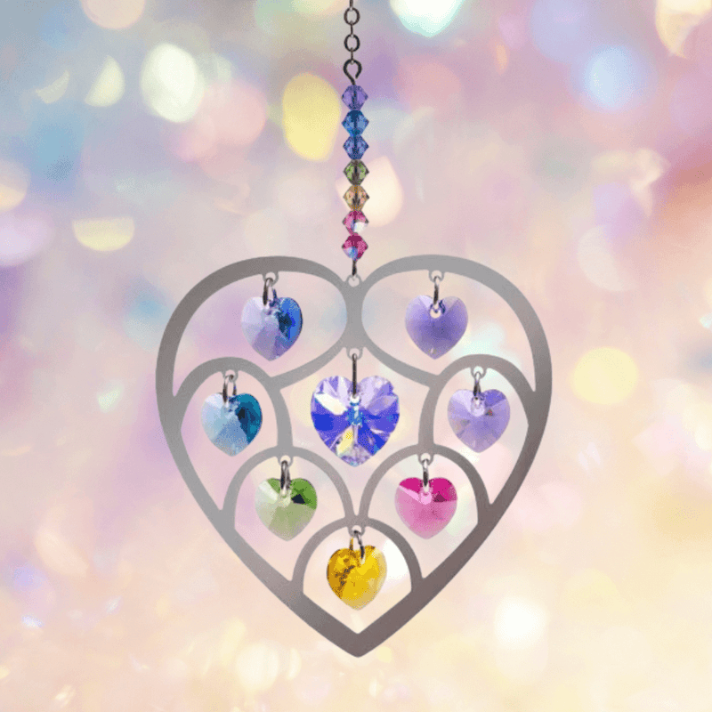 Heart of Hearts Confetti suncatcher sparkling against a pastel bokeh backdrop, ready to cast rainbows


