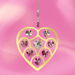 Gold Heart of Hearts deep-rose suncatcher sparkling against a pink backdrop, ready to cast rainbows

