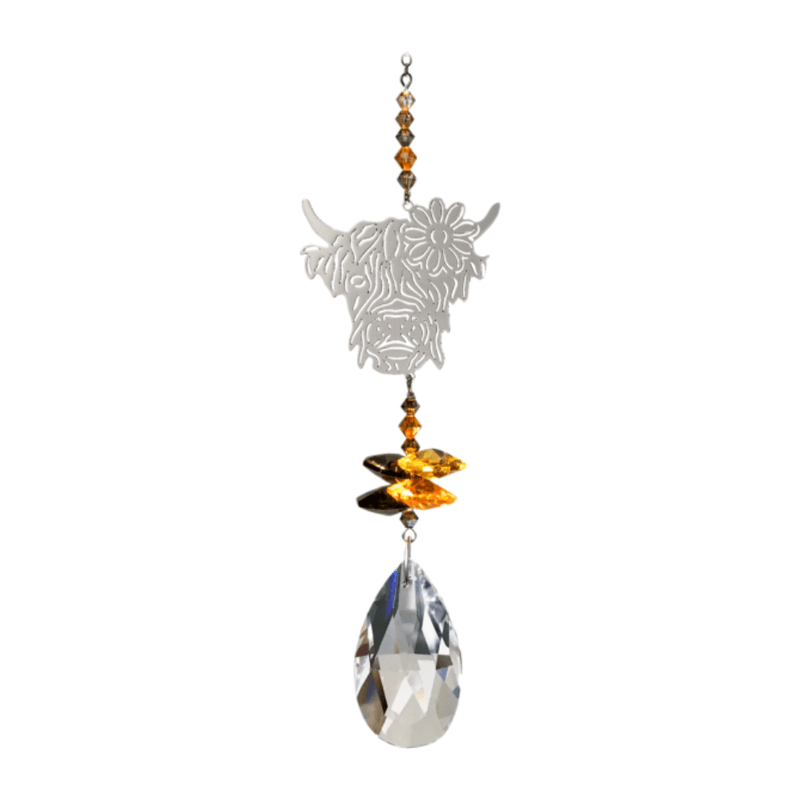 Wild Things Highland Cow Autumn Gold crystal suncatcher with silver cow design, amber crystals and clear teardrop prism on plain background