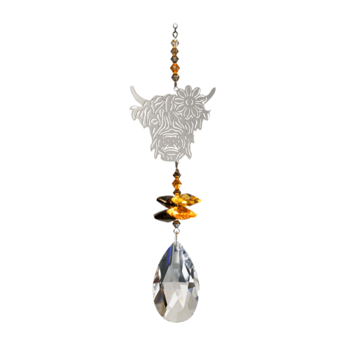Wild Things Highland Cow Autumn Gold crystal suncatcher with silver cow design, amber crystals and clear teardrop prism on plain background