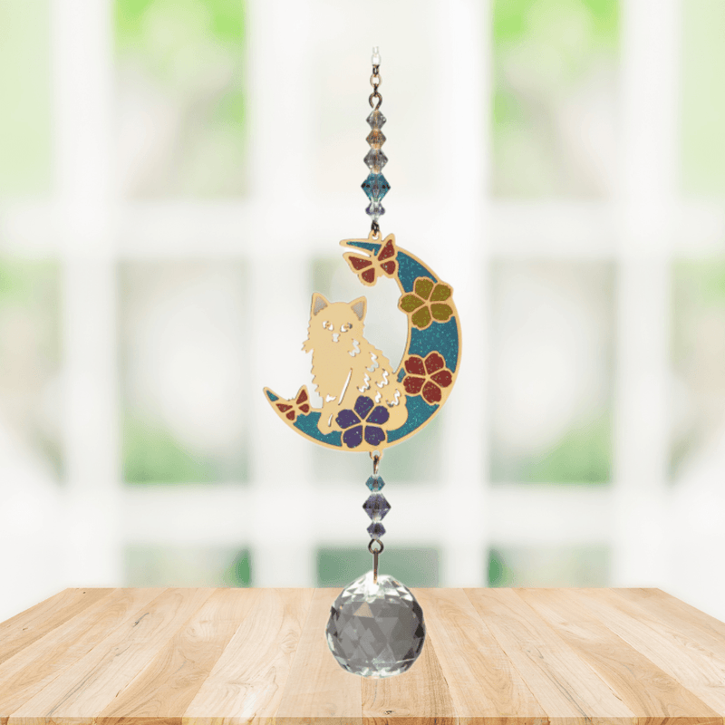 Wild Things Kitty on Moon multicolour crystal suncatcher hanging in a window with crystal beads and clear prism
