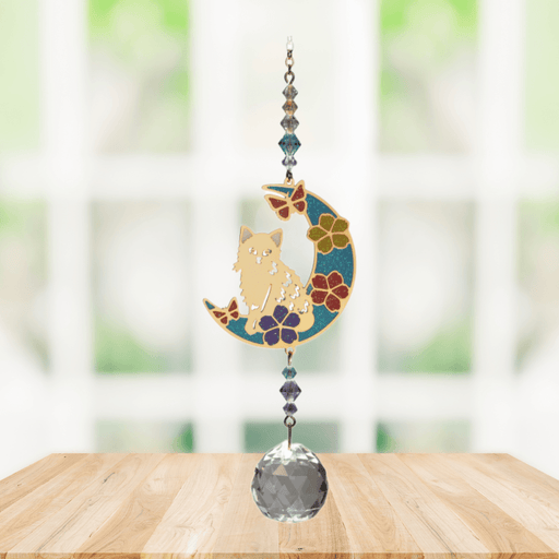 Wild Things Kitty on Moon multicolour crystal suncatcher hanging in a window with crystal beads and clear prism
