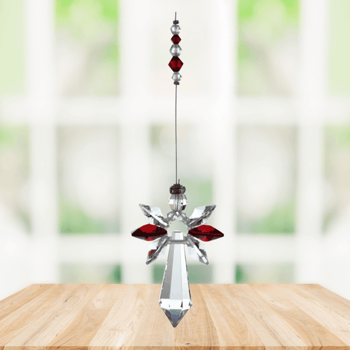 Large garnet guardian angel crystal suncatcher hanging in a bright window
