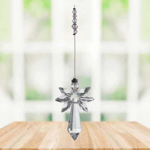 Large rose guardian angel crystal suncatcher hanging in a bright window