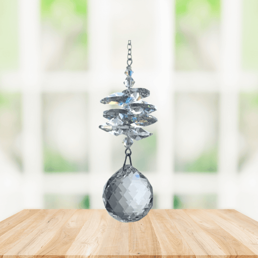 Wild Things clear crystal cascade suncatcher in window with brilliant 20mm ball pendant, rainbow maker