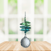 Wild Things green cascade crystal suncatcher in window with clear 20mm ball pendant, rainbow maker