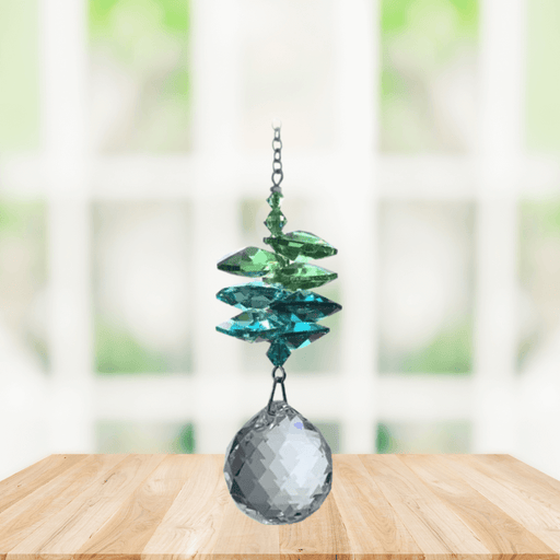 Wild Things green cascade crystal suncatcher in window with clear 20mm ball pendant, rainbow maker