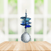 Wild Things royal blue cascade crystal suncatcher in window with clear 20mm ball pendant, rainbow maker