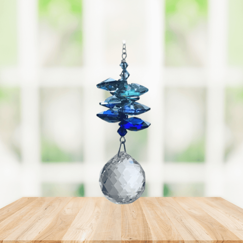 Wild Things royal blue cascade crystal suncatcher in window with clear 20mm ball pendant, rainbow maker