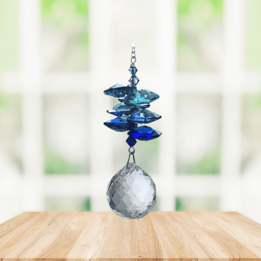 Wild Things royal blue cascade crystal suncatcher in window with clear 20mm ball pendant, rainbow maker
