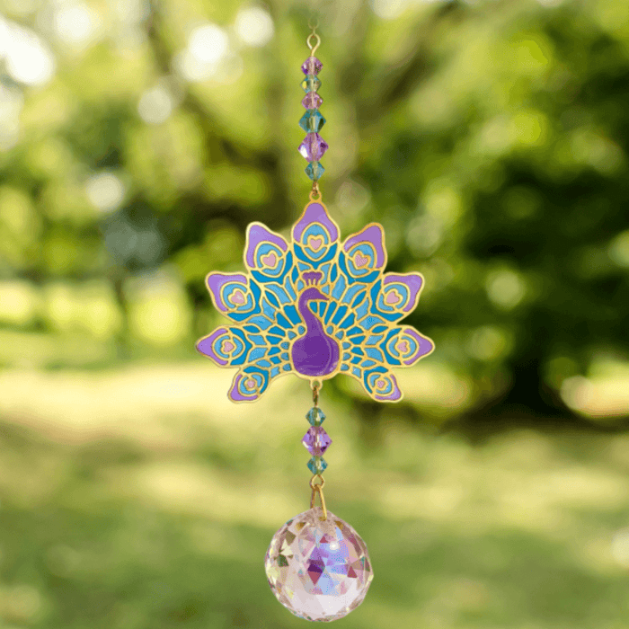 Peacock Purple Crystal Suncatcher sparkling in the garden – fanned tail motif, jewel-tone bead cascade and 20 mm prism scattering rainbow light.

