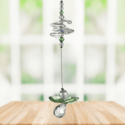 Peridot guardian angel crystal cascade suncatcher hanging in a bright window