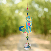 Puppy Bright Crystal Suncatcher catching dappled woodland light – colourful puppy, chakra bead cascade and 20 mm prism scattering rainbows.

