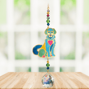 Puppy Bright Crystal Suncatcher hanging in a sunny window; jewel-tone dog motif, faceted rainbow beads and sparkling crystal ball.
