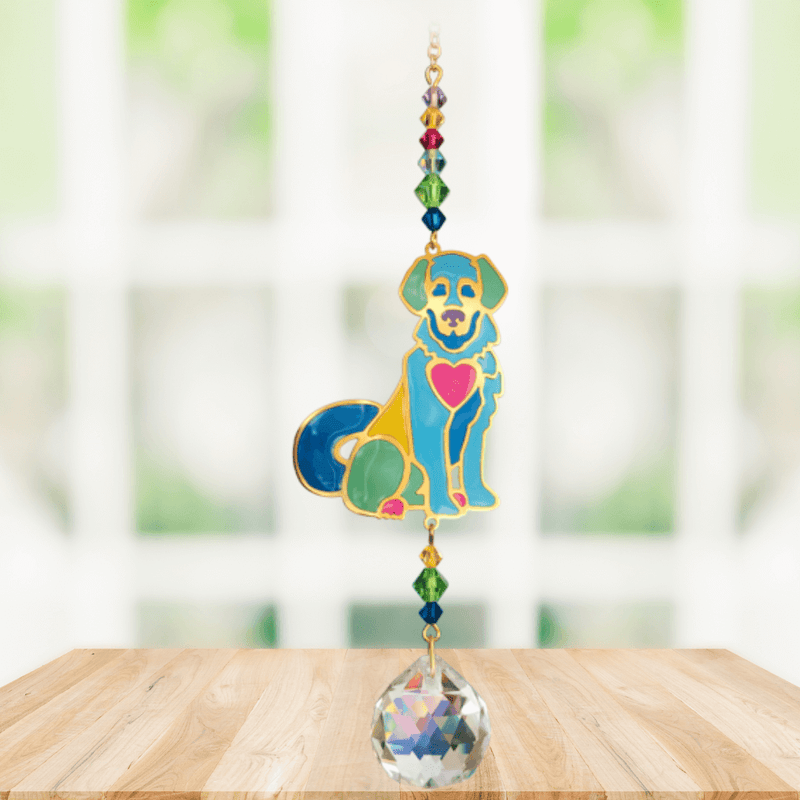 Puppy Bright Crystal Suncatcher hanging in a sunny window; jewel-tone dog motif, faceted rainbow beads and sparkling crystal ball.
