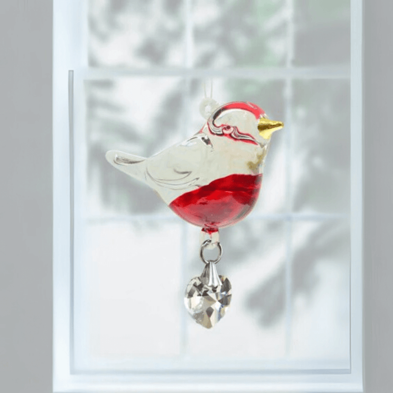 Robin crystal suncatcher hanging in a bright window, ready to cast rainbow light

