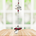 Ruby guardian angel crystal cascade suncatcher hanging in a bright window