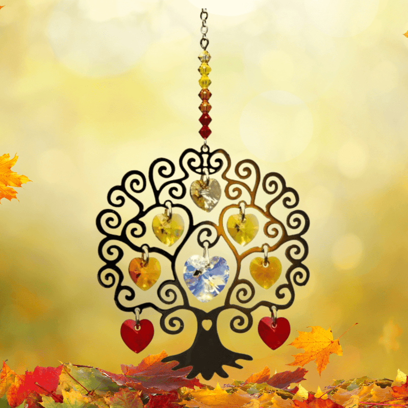 Tree of Life autumn crystal suncatcher gleaming among golden leaves in soft sunlight

