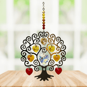 Tree of Life autumn suncatcher with amber-yellow crystal hearts displayed on a wooden table

