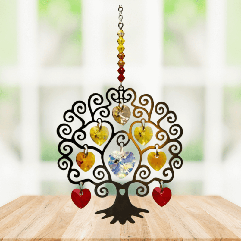 Tree of Life autumn suncatcher with amber-yellow crystal hearts displayed on a wooden table

