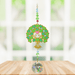 Tree of Life Green Crystal Suncatcher hanging in a bright window; heart-shaped foliage, gemstone-tone beads and sparkling crystal ball.
