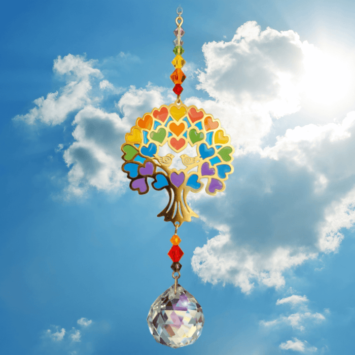 Tree of Life – Rainbow Crystal Suncatcher against bright sky; vibrant heart-leaf canopy, sunset bead cascade and 20 mm prism scattering rainbows.

