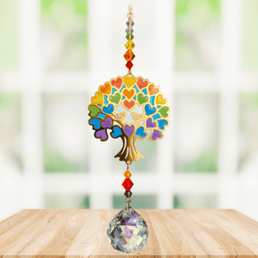 Tree of Life – Rainbow Crystal Suncatcher hanging in a sunny window; jewel-tone heart foliage, chakra bead run and sparkling crystal ball.
