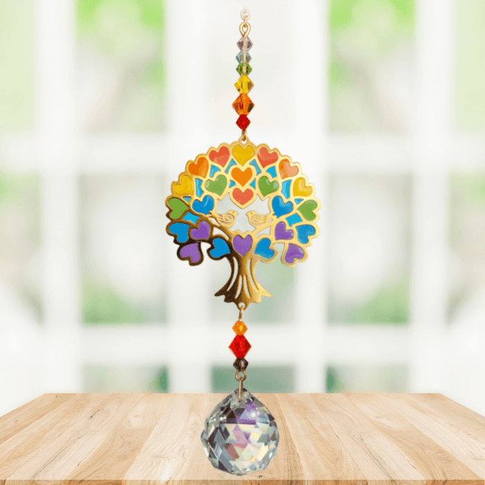 Tree of Life – Rainbow Crystal Suncatcher hanging in a sunny window; jewel-tone heart foliage, chakra bead run and sparkling crystal ball.
