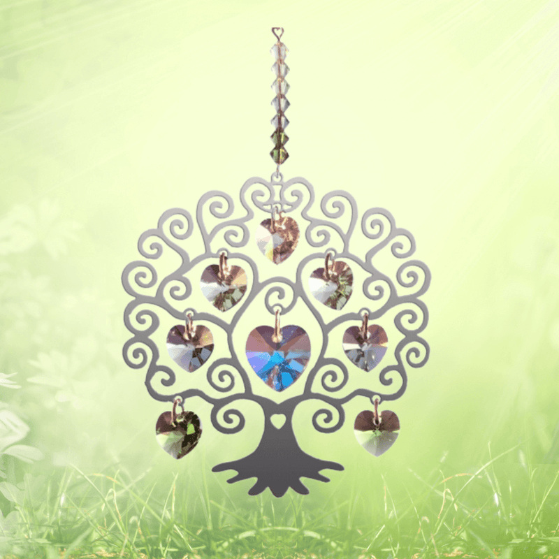 Tree of Life spring crystal suncatcher sparkling against fresh green meadow backdrop

