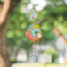 Unicorn Confetti Crystal Suncatcher twinkling outdoors – rainbow-flowing mane, pastel bead cascade and 20 mm prism scattering rainbow light.


