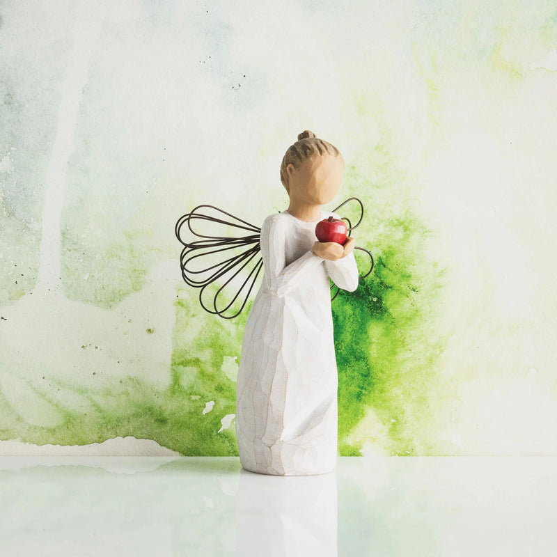 Display Image: Willow Tree You’re the Best Figurine with red apple against green watercolour background

