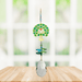 Tree of Life green Window Jewels crystal suncatcher hanging in a bright window, mirror-gold motif with green crystals and clear drop.