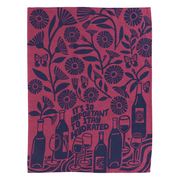 Flat lay Funny tea towel with wine bottles, glasses, and the phrase “It’s so important to stay hydrated”

