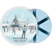 Winter Ice Skating blue segmented wax melt pot with people skating on a snowy outdoor ice rink under string lights
