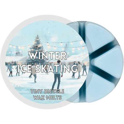 Winter Ice Skating blue segmented wax melt pot with people skating on a snowy outdoor ice rink under string lights