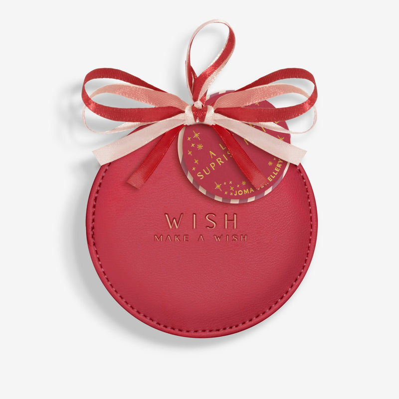 “Closed red bauble gift box with ‘Wish – Make a Wish’ gold text and ribbon bow”
