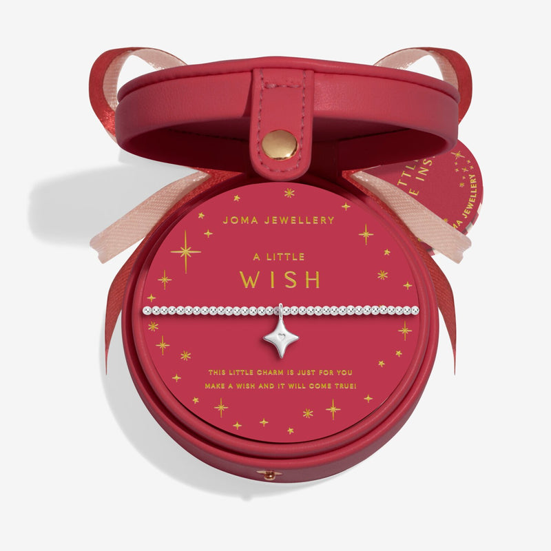 “Open red Christmas bauble gift box showing ‘A Little Wish’ bracelet inside”
