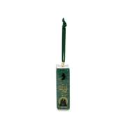 Green spine of The Wonderful Wizard of Oz ceramic book decoration with gold lettering and flying witch illustration