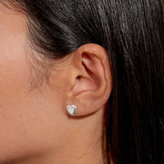 “Lifestyle image – silver heart stud earring worn in ear lobe”
